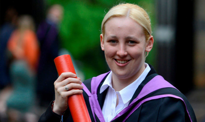 Mhairi Black with her degree scroll.