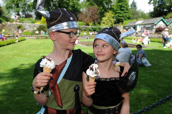 Dunfermline was a riot of colour as it hosted its annual childrens gala. Hundreds of people got into the festival spirit and took part in a parade through the town centre. Entertainment was provided throughout the afternoon in Pittencrieff Park, including dazzling gymnastics and circus acts. Photo shows Ronan and Erin Fitzgerald enjoying an ice cream.