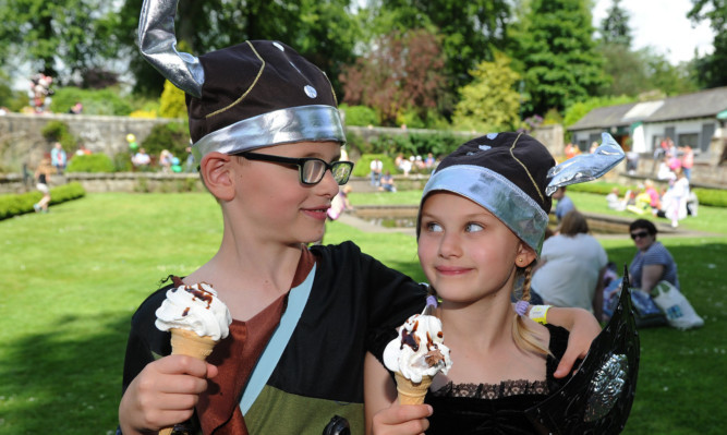 Ronan and Erin Fitzgerald enjoying an ice cream on a sunny day at the Dunfermline Children's Gala at the weekend. Forecasters say there is hotter weather ahead.