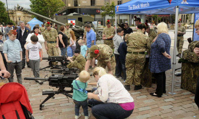 The Black Watch guns draw a lot of interest at Armed Forces Day in Dundee.