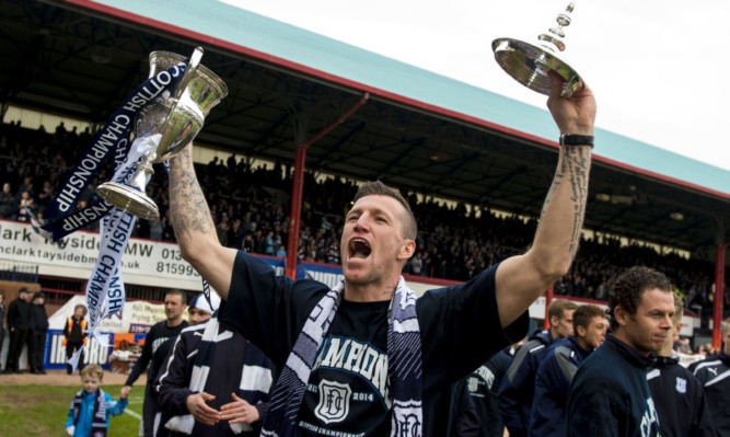 Iain Davidson celebrates winning the Championship with Dundee.