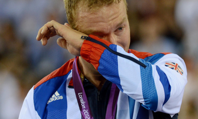 Scotland's Sir Chris Hoy shows his emotions after winning gold in the men's keirin final at London 2012.