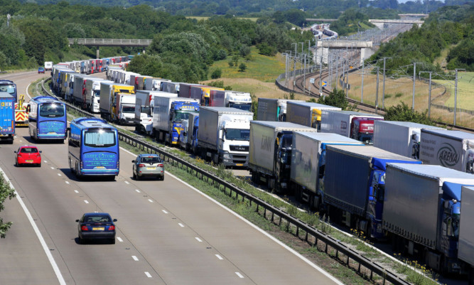 Lorries parked on the M20 near Charing in Kent as Operation Stack remains in place due to industrial action in Calais.