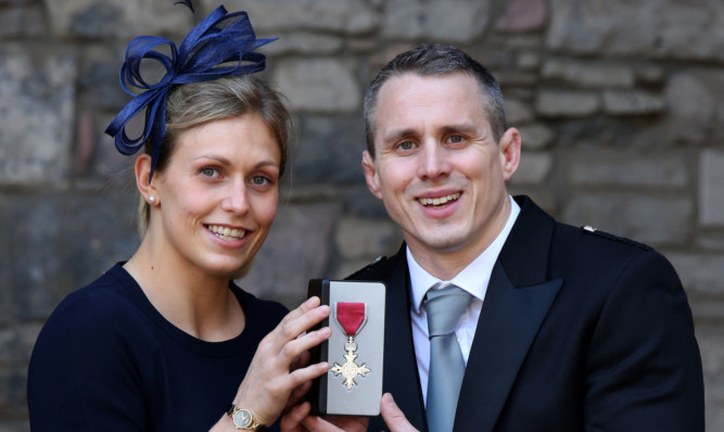 Commonwealth games Gold medallist Euan Burton with his wife Gemma Gibbons after he was made an MBE for services to judo.
