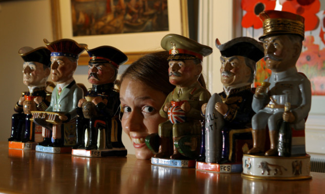 Museum assistant Louisa Couttie with, from left, Woodrow Wilson, Herbert Kitchener, Douglas Haig and David Lloyd George.