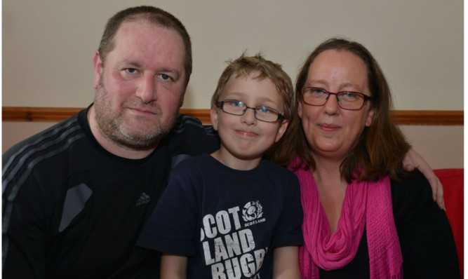 John Hutton and Mairead Murray with their son Caoimhin.