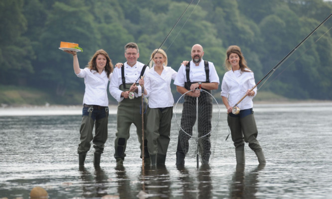 In the Tay, next to Scone Palace, are, from left, Nichola Reith, Christopher Trotter, Gillian Reith, Tom Lewis and Linsey Reith.