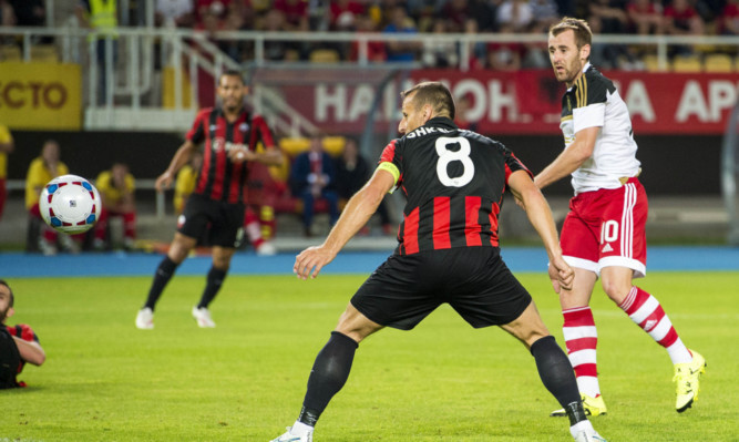 Aberdeen's Niall McGinn fires his side into the lead.