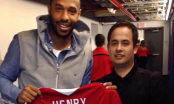 Abe Taylor gets the Arsenal strip signed by Thierry Henry.