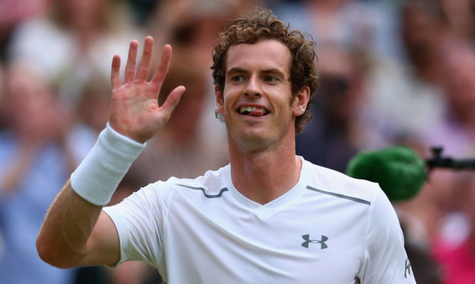 Andy Murray celebrates reaching the fourth round.