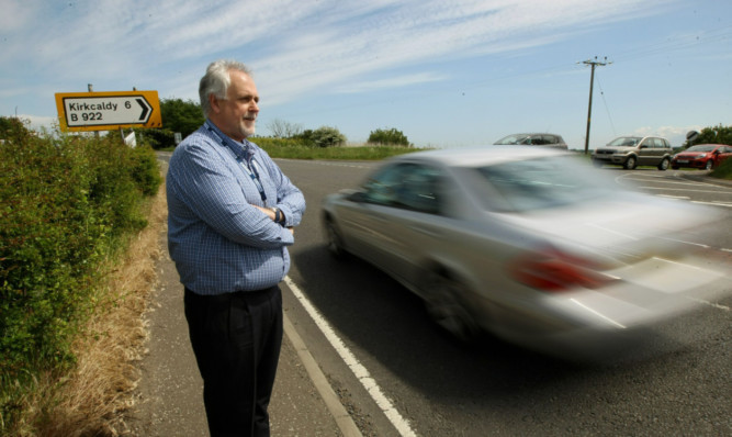 Councillor Bill Brown on the B921 Kinglassie road, where it joins with the B922 Glenrothes to Cluny road.
