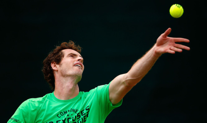 Andy Murray practices at Wimbledon.