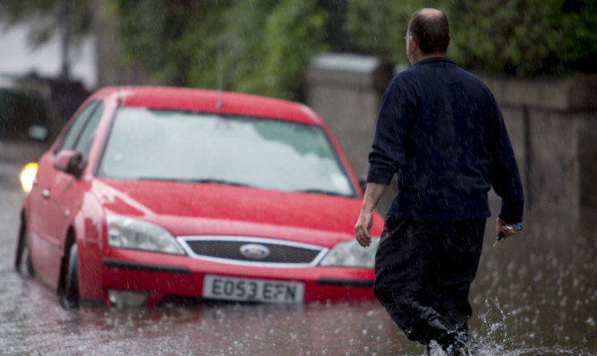 Flooding made Polmuir Road in Aberdeen impassable.