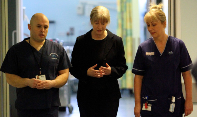 Cabinet secretary for health Shona Robison, centre, with consultant Andrew Reddick and specialist charge nurse Moira Raitt during a visit to Ninewells Hospital. Jenny says the SNPs record on health is a poor one.