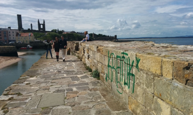 The tag on the harbour wall.