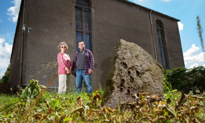 Campaigners Craig Finlay and Jess Smith in the St Michaels graveyard.