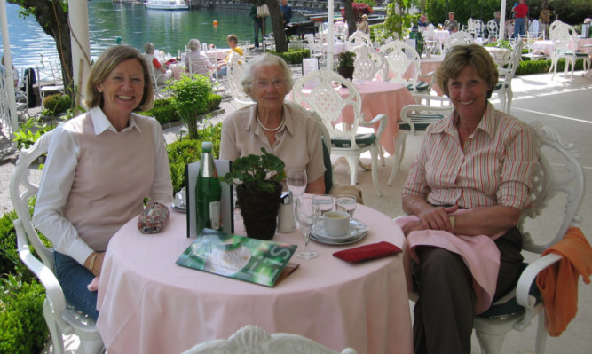 Margaret Phillips (centre) says a love of curry and a dram before bed has helped her enjoy a long life.