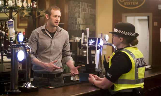 Inspector Susan Gillon chats to Butterfly and Pig employee Paul Banham during the launch of a the latest phase of rape prevention campaign in Glasgow.