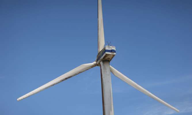 GUANACASTE, COSTA RICA - MARCH 26:  A wind turbine run by the Costa Rican Electricity Institute (ICE) is seen along a ridge line as the power company has managed to produce all of the electricity for the nation from renewable energy sources for more than 80 days straight on March 26, 2015 in Guanacaste, Costa Rica.  The milestone has been reached with the use of hydroelectric power plants and a combination of wind, solar, and geothermal energy.  (Photo by Joe Raedle/Getty Images)