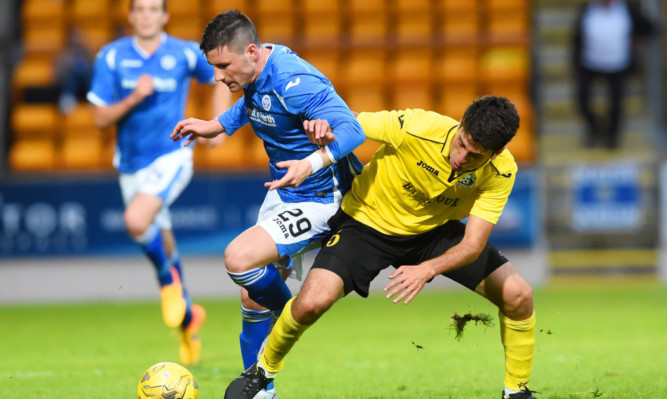 St Johnstone's Michael O'Halloran challenges for the ball with Karen Muradyan (right)