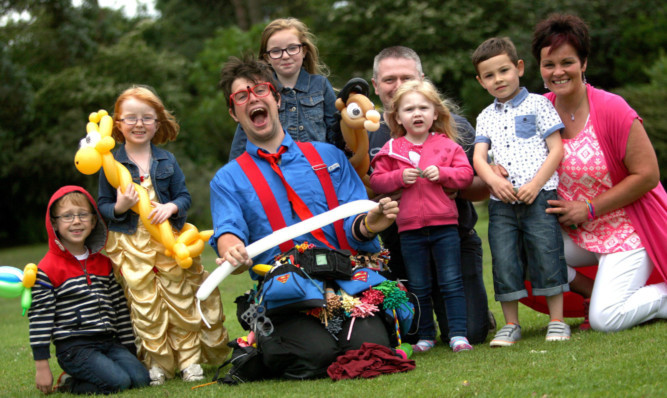 Entertainer Talented Ted makes balloon animals for visitors to the Gala in the Garden at Barnhill Rock Garden to celebrate the attractions 60 years.