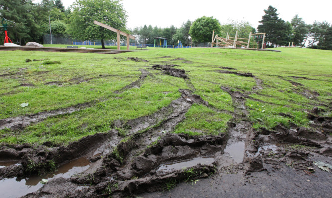 The damaged ground at Mill O' Mains park.