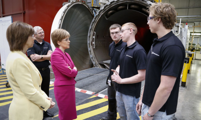 First Minister Nicola Sturgeon talks to apprentices at UTC Aerospace Systems.