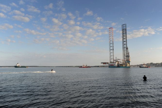 Supplied - 30.05.13 - pictured is the Rowan Stavanger rig leaving Dundee - passing Broughty Ferry - fisherman David Muir continued his sport