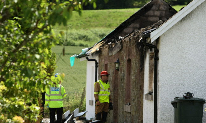 Police and fire investigators were at the cottage trying to discover the cause of the blaze.