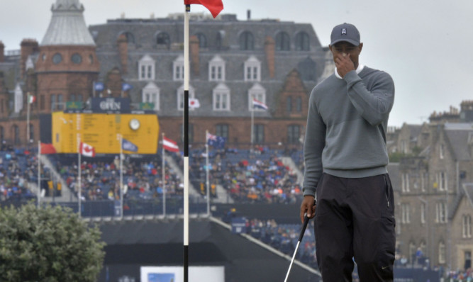 A dejected Tiger Woods at the 16th green during yesterday's first round.