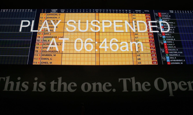 A view of the scoreboard in the media centre saying 'Play Suspended' during day two of The Open Championship 2015 at St Andrews, Fife. PRESS ASSOCIATION Photo. Picture date: Friday July 17, 2015. See PA story GOLF Open. Photo credit should read: Danny Lawson/PA Wire. RESTRICTIONS: Editorial use only - no commercial use. No onward sale. Still image use only. The Open Championship logo and clear link to The Open website (www.TheOpen.com) to be included on website publishing. Call +44 (0)1158 447447 for further info.