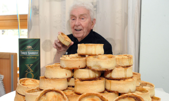 James Crombie with his favourtie pies and brandy.