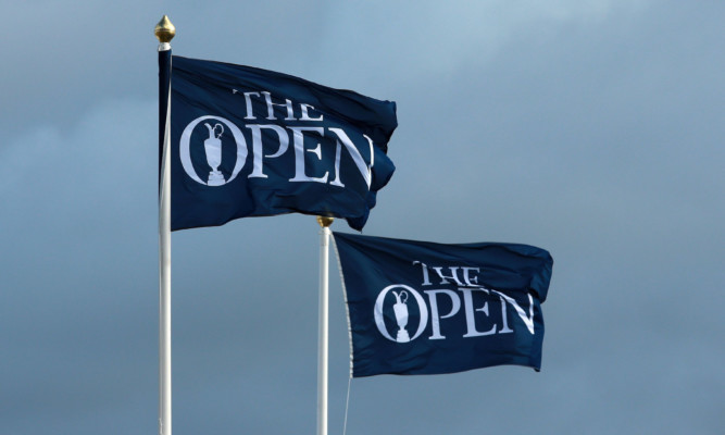 A view of flags blowing as high winds suspend play during day three of The Open Championship 2015 at St Andrews, Fife. PRESS ASSOCIATION Photo. Picture date: Saturday July 19, 2015. See PA story GOLF Open. Photo credit should read: David Davies/PA Wire. RESTRICTIONS: Editorial use only - no commercial use. No onward sale. Still image use only. The Open Championship logo and clear link to The Open website (www.TheOpen.com) to be included on website publishing. Call +44 (0)1158 447447 for further info.