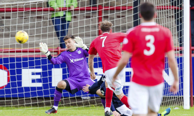 Brechin's Robert Thomson scores the only goal of the game.