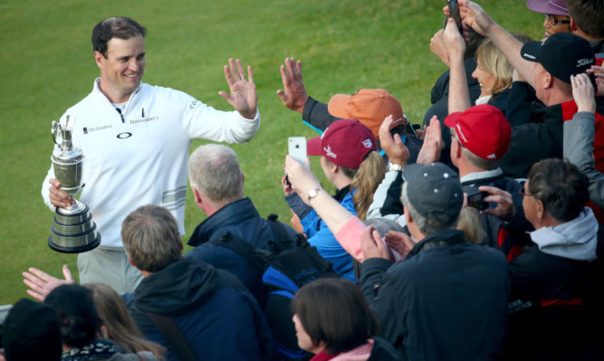 Zach Johnson celebrates with fans, who he praised as "awesome".