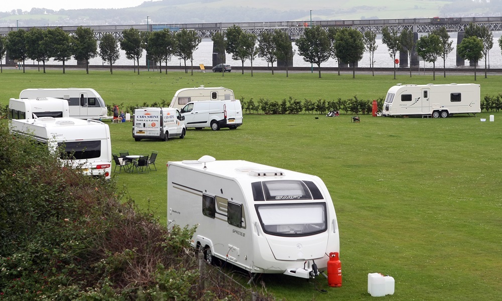 Kris Miller, Courier, 20/07/15. Picture today on Riverside where travellers have set up opposite Magdalen Green, the small group consisting of around six caravans have moved onto the site which saw a much larger encampment just weeks ago.