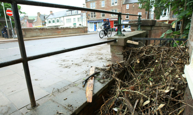 Piles of debris lying in Alyth.