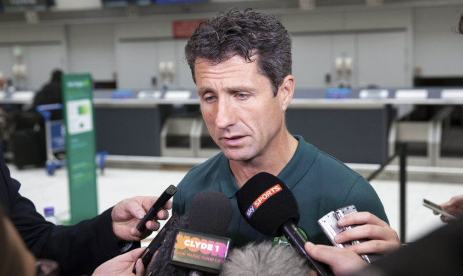 Celtic assistant manager John Collins speaks to the press Glasgow Airport.