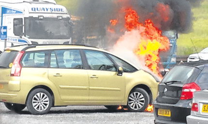 Gordon Dougall's family car bursts into flames.