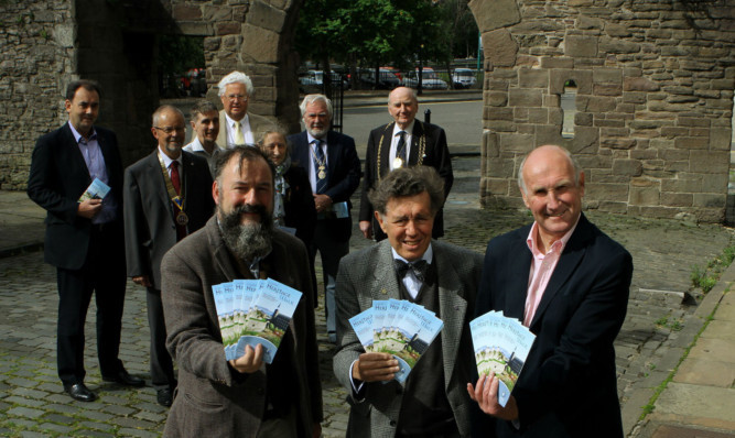 At the launch of the latest Dundee Heritage Walk guide are (front, from left) Dundee Historic Environment Trust director Adam Swann, DHET trustee Chris Davie and chairman Ian Mudie with some of the other sponsors and walk committee members.
