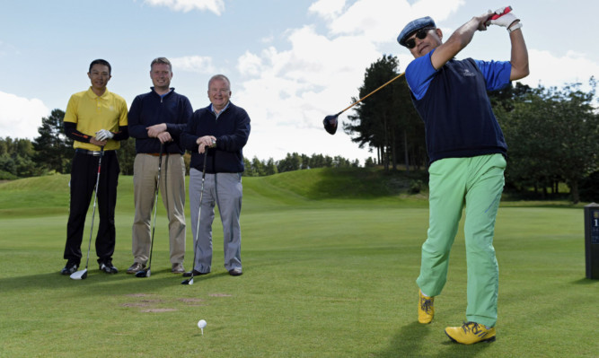 At Forfar Golf Club are, from left, Yifan Li, club secretary Stuart Wilson, David Valentine and Wei Jian Li.