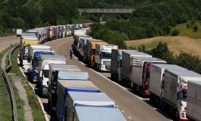 Lorries parked on the M20 near Charing in Kent.