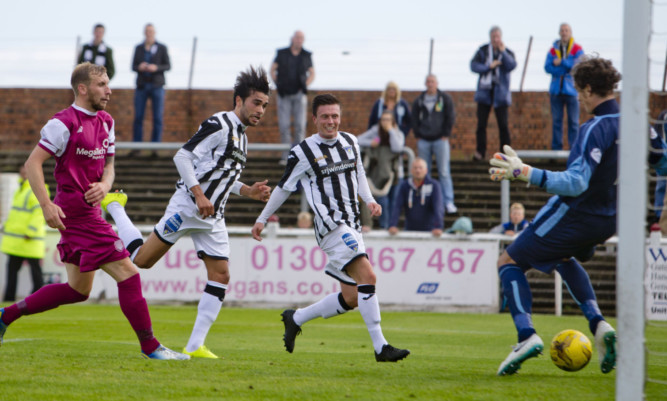 Two-goal Faissall El-Bakhtaoui heads home Dunfermlines third past Lichties keeper Allan Fleming as they cruised into the second round.