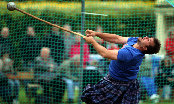 One of the heavies competes in the hammer at the Fife games.