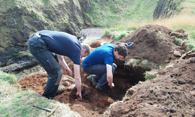 Oskar Sveinbjarnarson (left) and Neil Curtis during the archaeological excavation.
