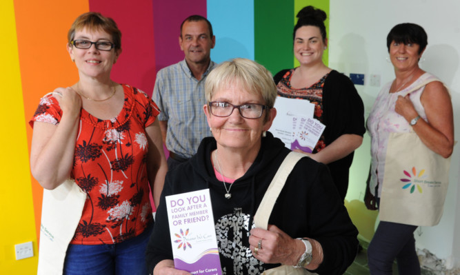 Back from left: Dundee Carers Centre staff Adele Donald, Alastair Smeaton, Louise Ferguson and Vanessa Dallas-Ross with carer Stella Hutchison, who is going to make use of its new Short Break Service.