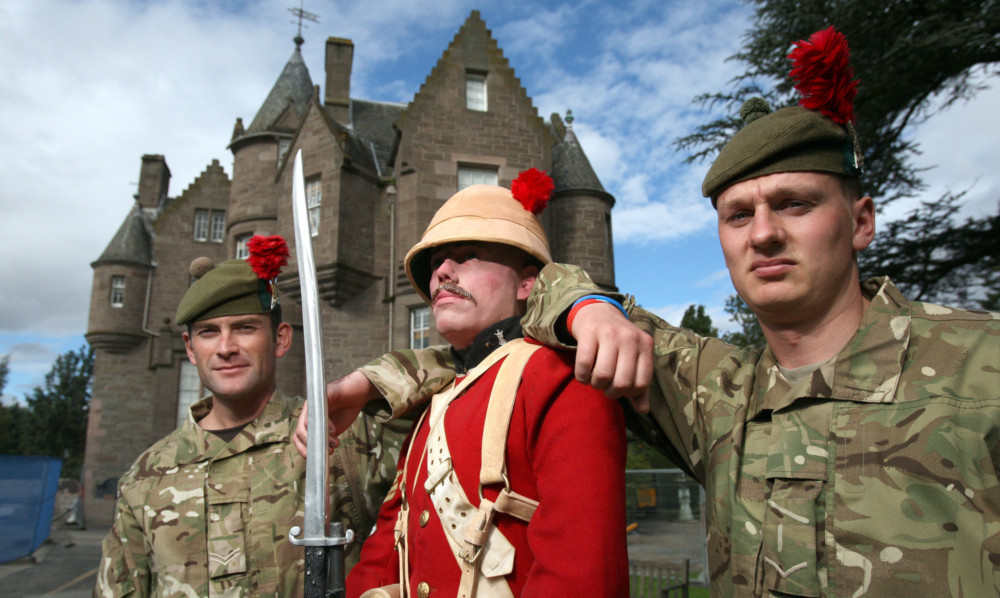 (From right) Pte Wayne Ferguson, Cpl Ruaridh Wedgwood and LCpl Stephen Nisbet with 'Hector' a museum mascot.