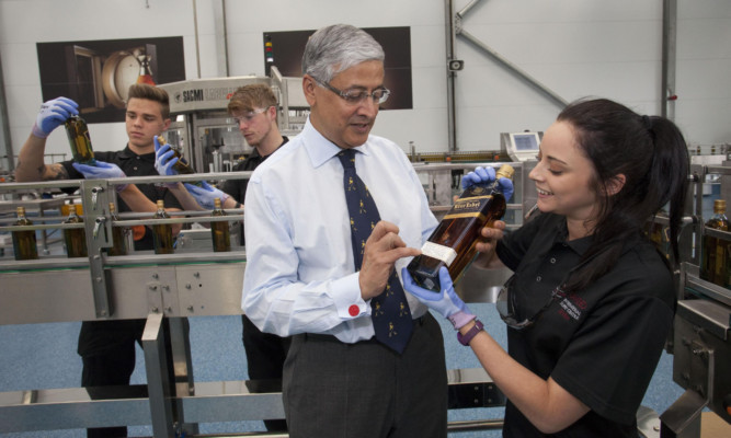 Diageo chief executive Ivan Menezes talks with apprentices during a visit to the Leven plant in June.
