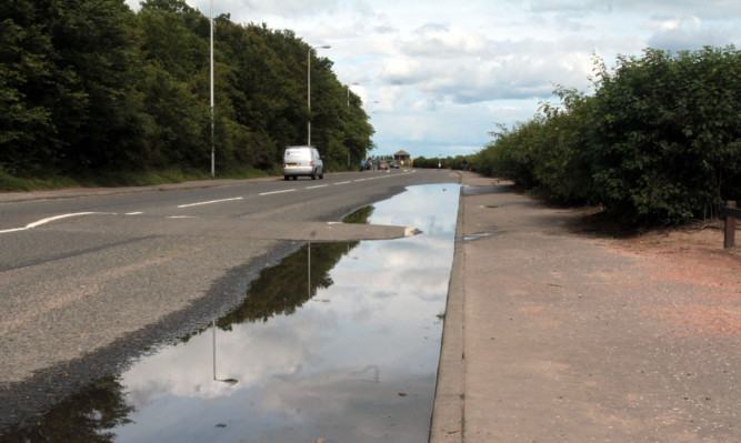 The driver is accused of deliberately driving through large puddles on the Esplanade Broughty Ferry.