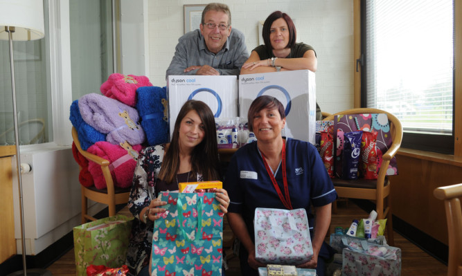 Shown with some of the items purchased for the patients of ward 32 are, back, Jim Gardiner and Beverley Davidson and, front, Kimberley Gardiner and senior charge nurse Lynne Clarke.